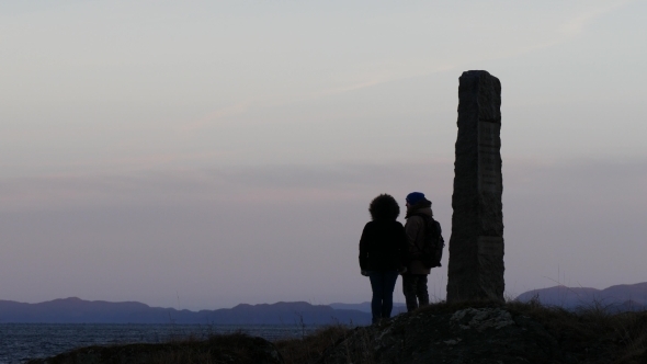 A Couple Enjoy View On Fjord At Sunrise, Trondheim Norway