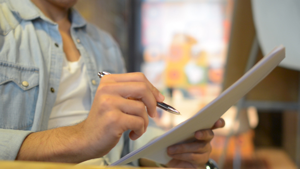 Man Reading Papers alt