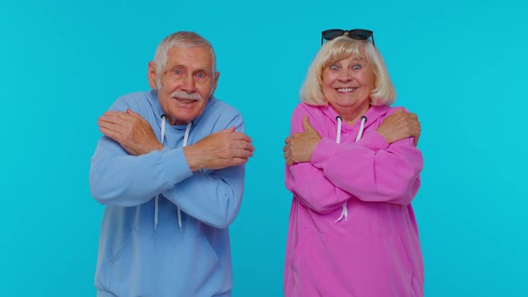 Cheerful Lovely Senior Couple Man Woman Grandparents Spread Hands and Give Hug to you Love Feelings