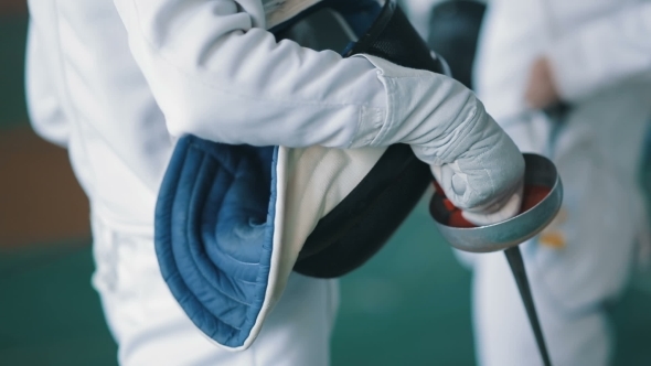 Fencing Mask and Foil in a Hands of Fencer