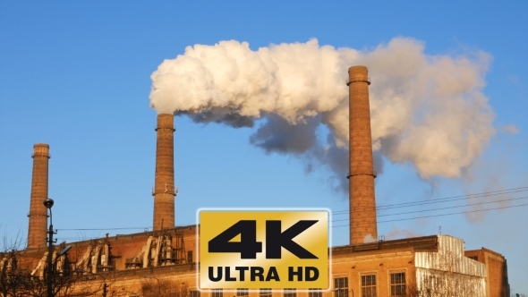 Factory Plant Smoke Stack Over Blue Sky Background alt