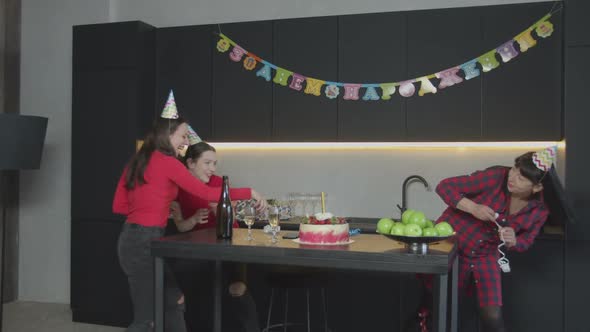 Happy Women Throwing Serpentine on Birthday Party