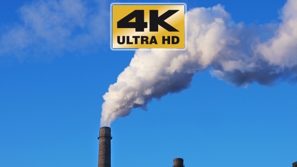 Factory Plant Smoke Stack Over Blue Sky Background alt
