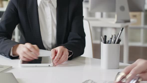 Businessman and Woman Agreeing about Contract