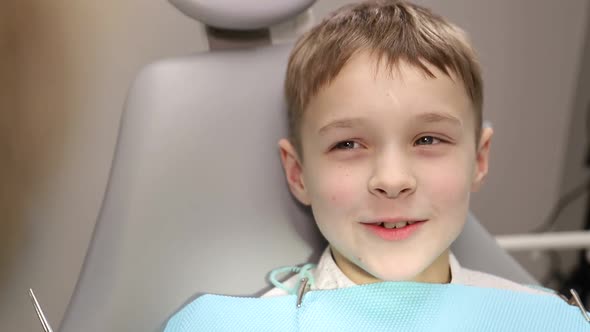 Dentist examines the baby teeth. Painless dental treatment, caries in children