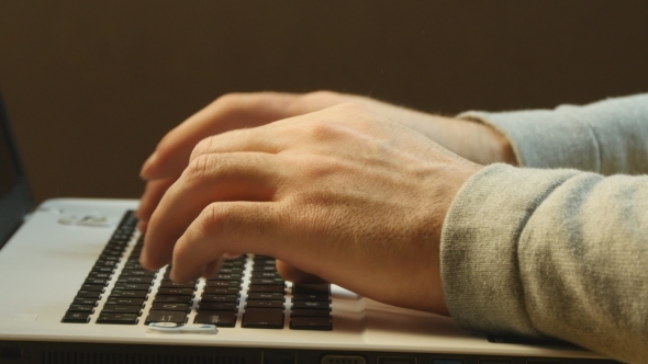 Hands Typing On a Laptop Keyboard 