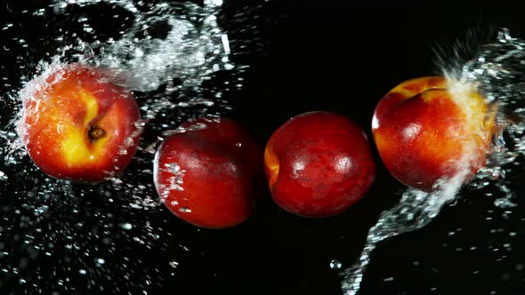 Super Slow Motion Shot of Flying Fresh Peach and Water Side Splash on Black Background at 1000Fps