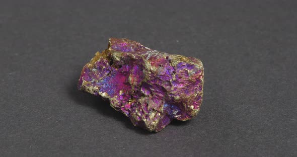 Mineral Chalcopyrite on a Dark Background