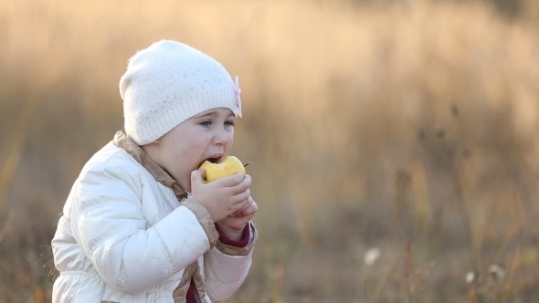 Child Eating An Apple