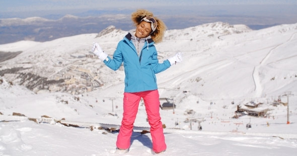 Single Woman In Ski Clothes Waving Arms