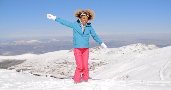 Happy Adult In Ski Clothes Waving Arms