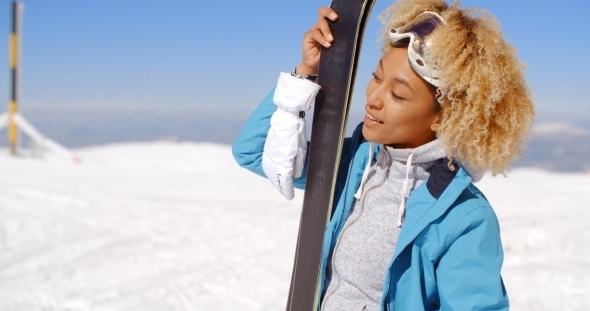 Beautiful Woman Holding Skis With Copy Space