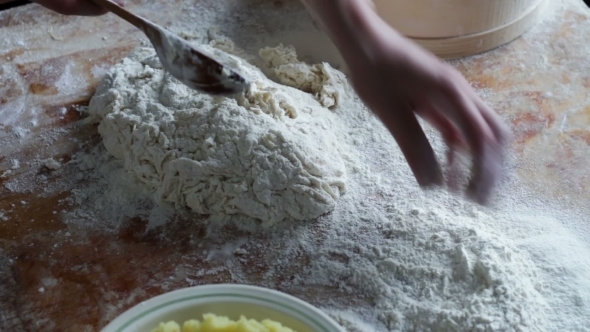 Woman Prepares Dough For Dumplings At Home Kitchen