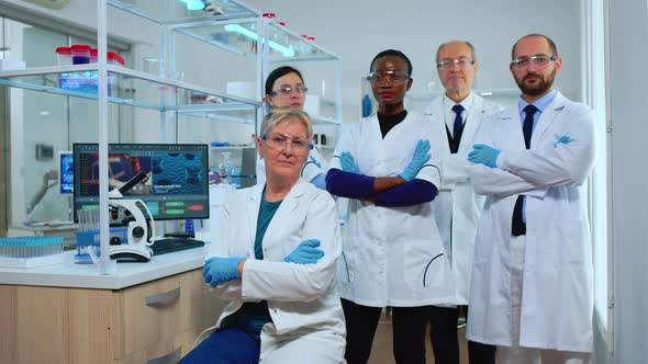 Multiethnic Team of Experienced Scientists Looking at Camera