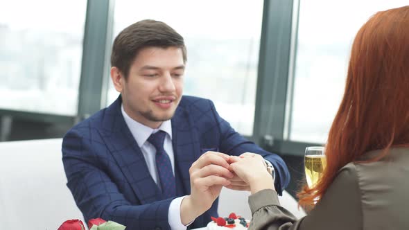 Young Man Making Marriage Proposal To Girlfriend.