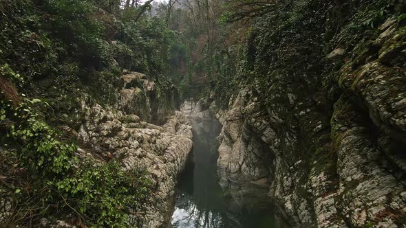 River in a Narrow Canyon with White Rocks