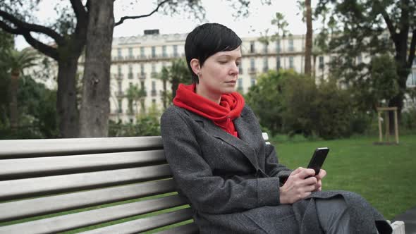 Adult Woman Using App on Smartphone To Send Message.