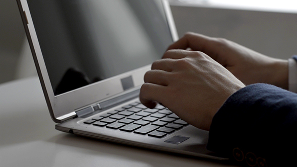 Man Working On Laptop