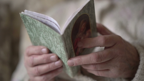 Prayer Book In Old Woman's Hands
