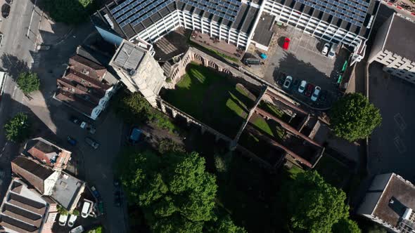 Descending crane drone shot of temple church ruins bristol