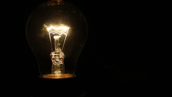 A Light Bulb Illuminates in a Dark Room