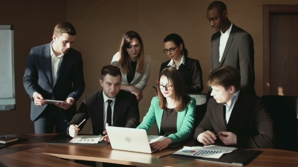 Group Of Businessman Communicate Using Laptop