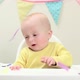 Baby boy sitting in highchair with bunting - VideoHive Item for Sale