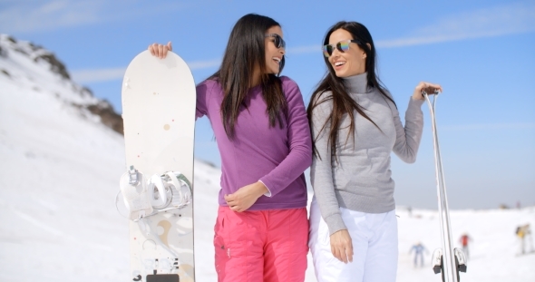Cute Sisters With Snowboards