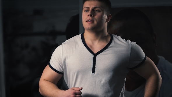 Man On Running Machine In Gym alt