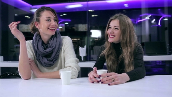 Girlfriends Drinking Coffee And Talking In Cafe alt