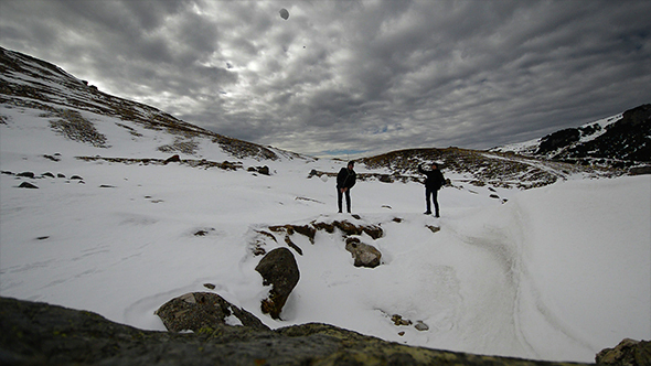 People Throwing Snowballs on the Camera