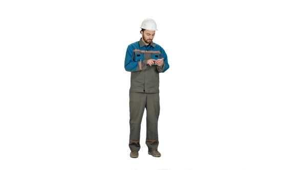 Construction Worker Using Cell Phone To Send Message On White Background.