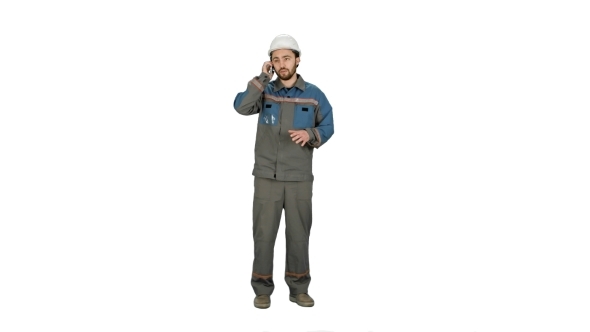 Construction Worker Talk With Cell Telephone On White Background.