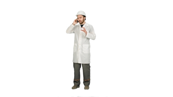 Engineer Talking On The Phone On a Construction Site On White Background.