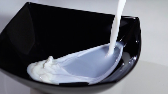 Milk In A Black Bowl