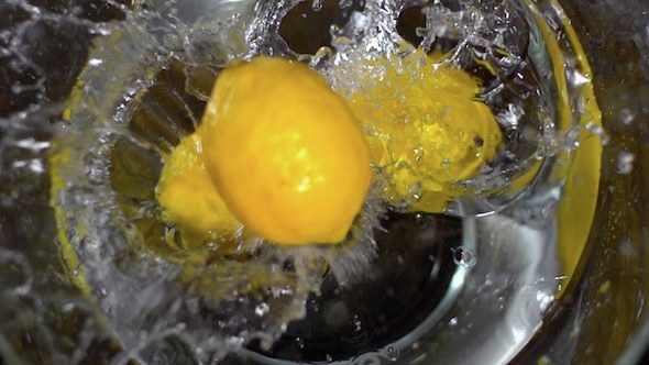 Lemons Falling Into Water