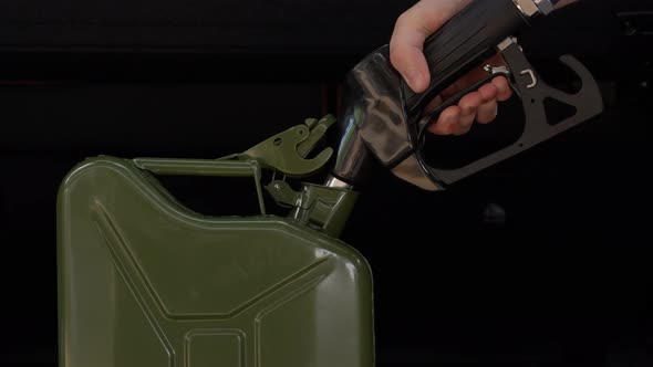 Filling Up a Jerrycan Fuel Container at a Petrol Station 12