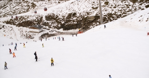 View From a Ski Lift Of Skiers Below On a Run