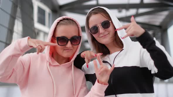 Two Sisters Dance Hip Hop the Show Gestures with His Hands