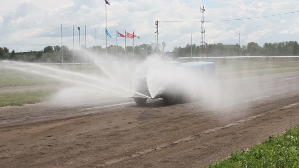 Watering And Cleaning Machines At The City Street.