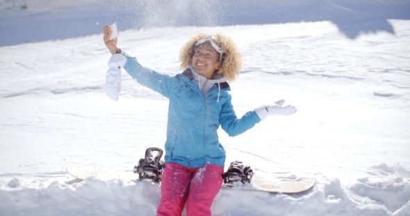Playful Woman Posing For a Selfie In The Snow alt