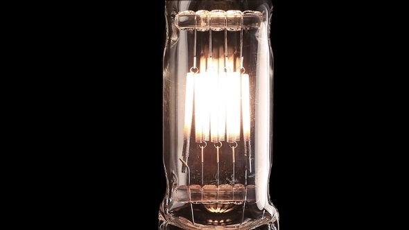 Halogen Lamp. Real Light Bulb Flickering. Tungsten Filament Of Electric Bulb. 