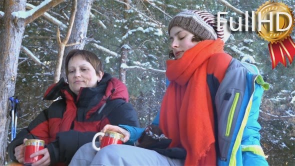 Two Women in The Winter, at a Picnic, Drinking