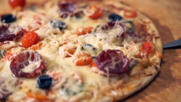 Pizza With Ham, Pepper, Tomato And Olives