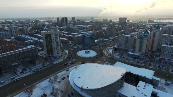 Flight Over The City In Winter. Panorama Of The City From The Air