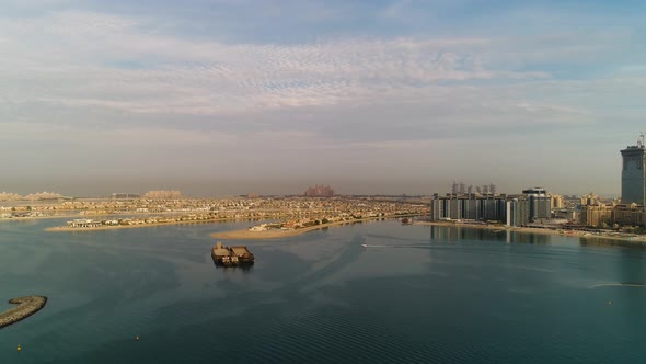 Calm aerial view of Persian Gulf with Dubai at the background, U.A.E.