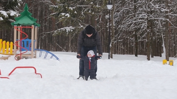Family Played On The Playground In Winter Park