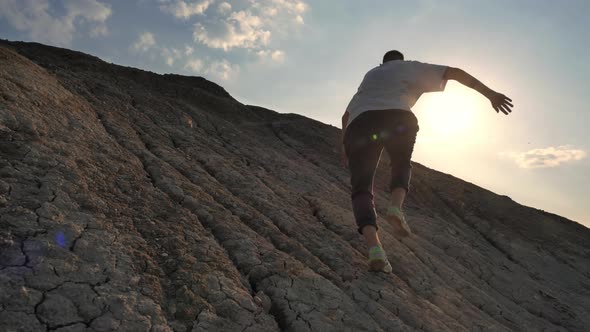 Man Runs and Climbs Uphill