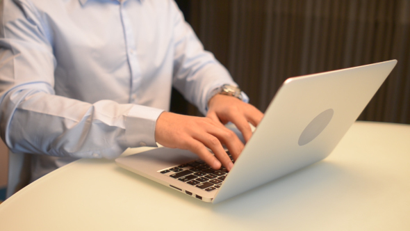 Businessman Using And Typing laptop