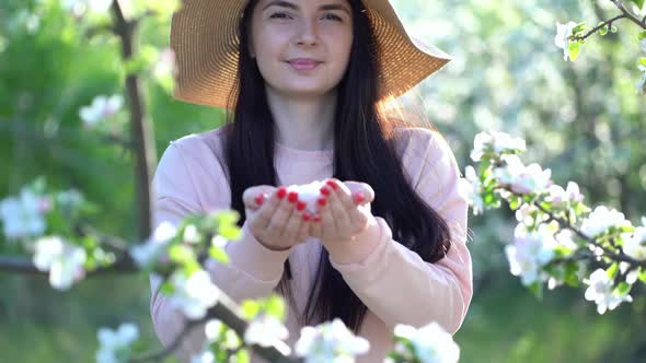 Beauty Young Woman Enjoying Apple Blooming Spring Orchard.